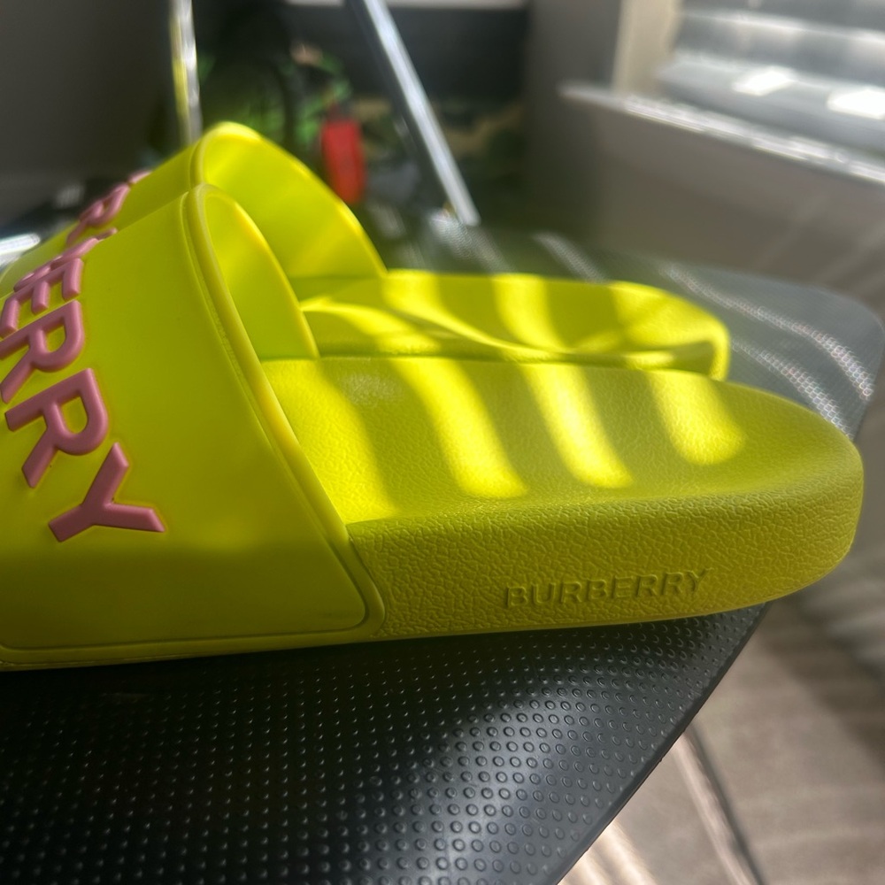 Neon green and pink Burberry slides